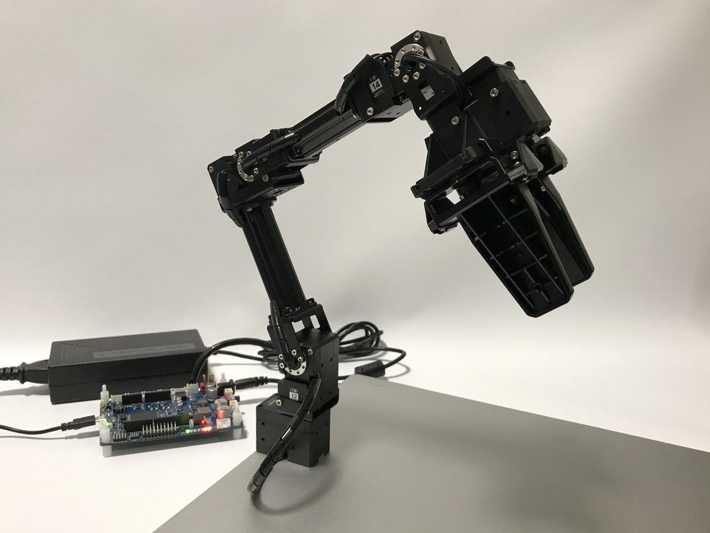 The OpenManipulator-X robotic arm with its OpenCR control board.